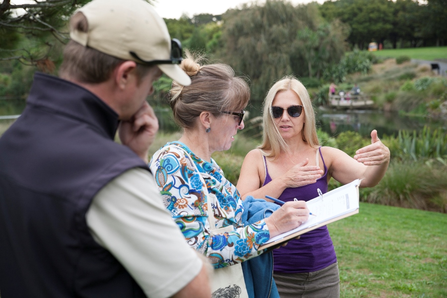 Linda Tyler, curator and Samantha Lissette in discussion with Gardens' staff