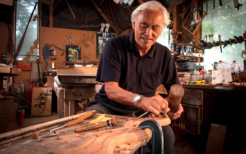 Fred Graham carving in his studio
